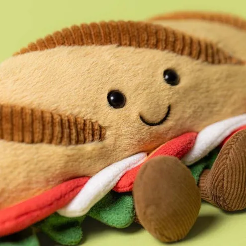 Jellycat Baguette plišanac s nasmijanim licem